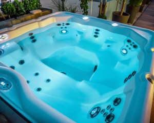 Hot tub illuminated at night time