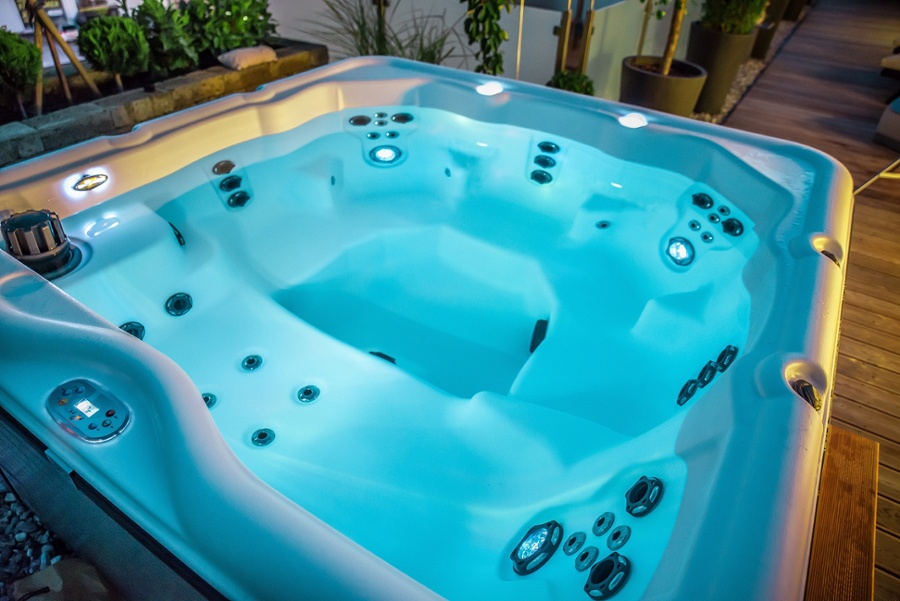 Hot tub illuminated at night time