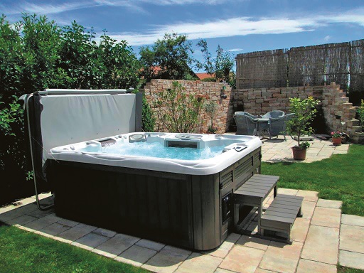 Outdoor hot tub with a hot tub cover.