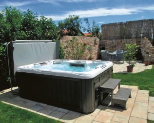 Outdoor hot tub with a hot tub cover.