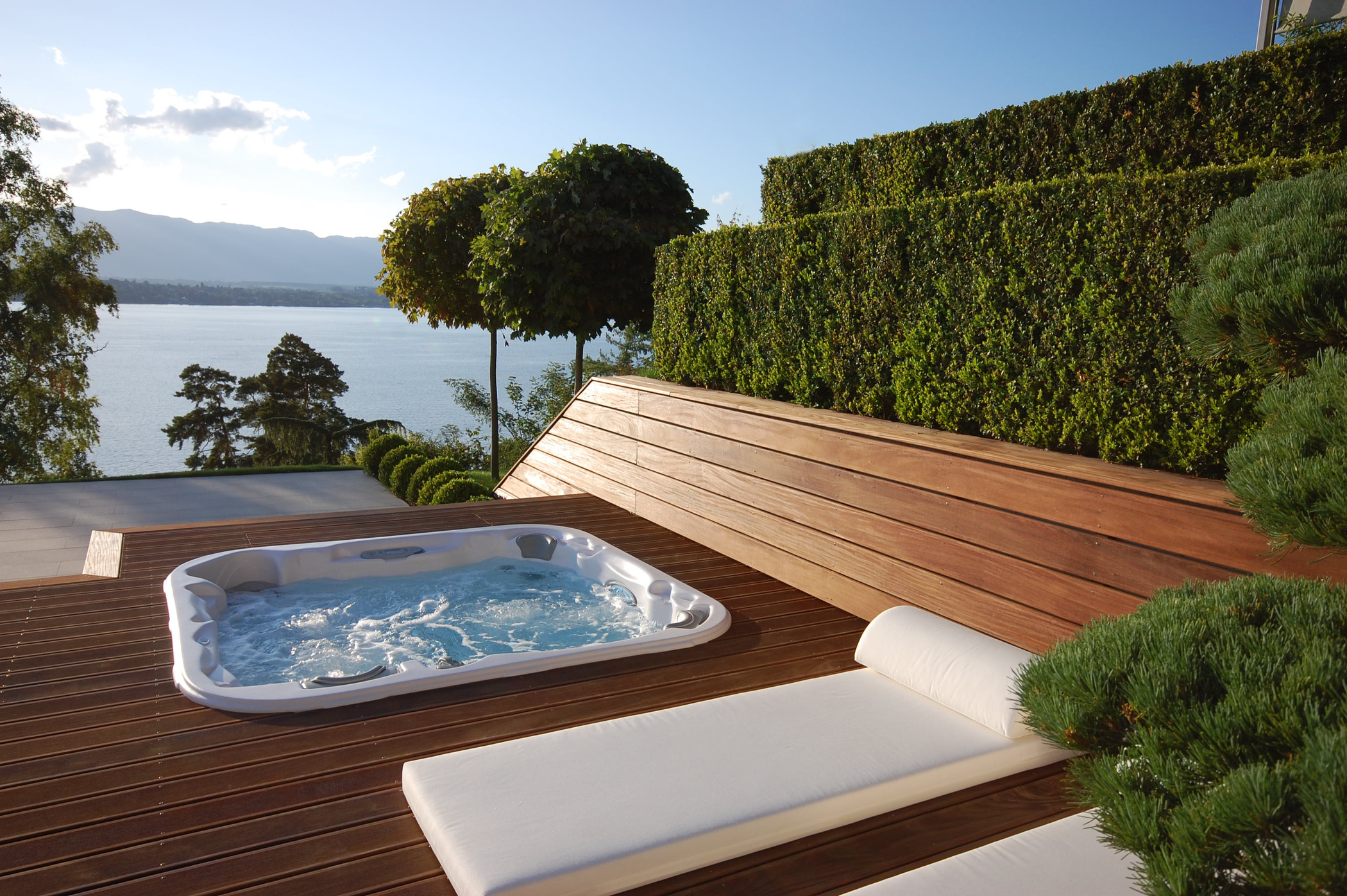 Outdoor hot tub installation on a patio in the spring.
