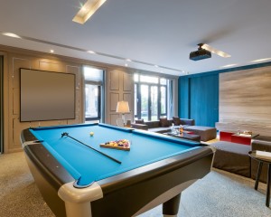 Pool table in modern game room.